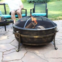 34 In. X 23 In. Round Large Steel Cauldron Wood Fire Pit In Black With Spark Screen -Fire Place Store black sunnydaze wood burning fire pits nb cf34 31 1000